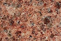 A black and red granite with a coarse texture.