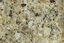 A gold and beige granite with light veins.