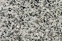 A grey, black and white granite that is fine grained.