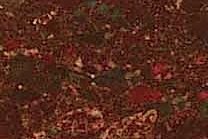 A red and burgundy colored granite.