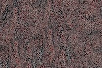 A red granite with grey and black veining.