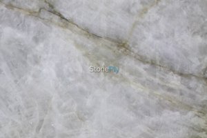 A cream colored granite with veins.