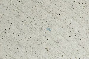 A white granite with dark flecks.