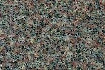 A dark red and black granite with a coarse texture.