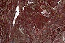 A red marble with a breccia pattern.