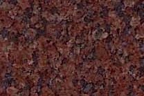 A dark red granite with dark grey to black veins.