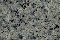 A green and grey granite with black pieces.