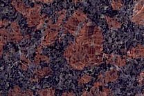 A brown and black granite with grey spots.