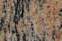 A beige and yellow granite with black and grey veins.