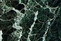 A green marble with white veins.