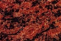 A red granite with lengthy black spots.