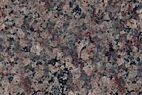 A pink and brown granite with blue, violet and red specks.